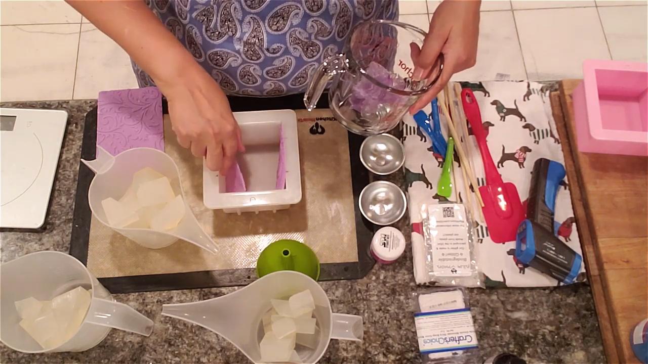 Impression mat strip attached to the side of a square soap mold