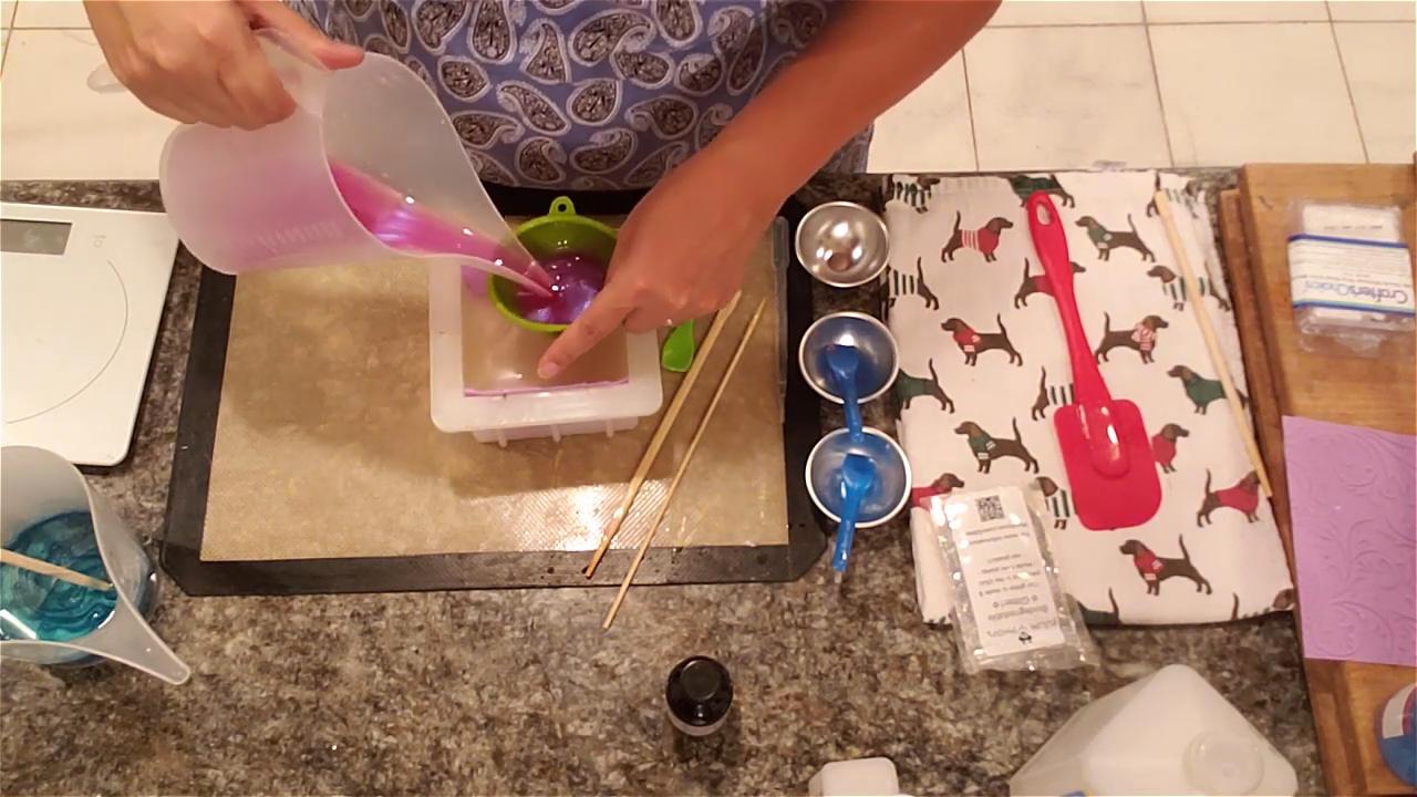 Pouring blue soap through a silicone funnel