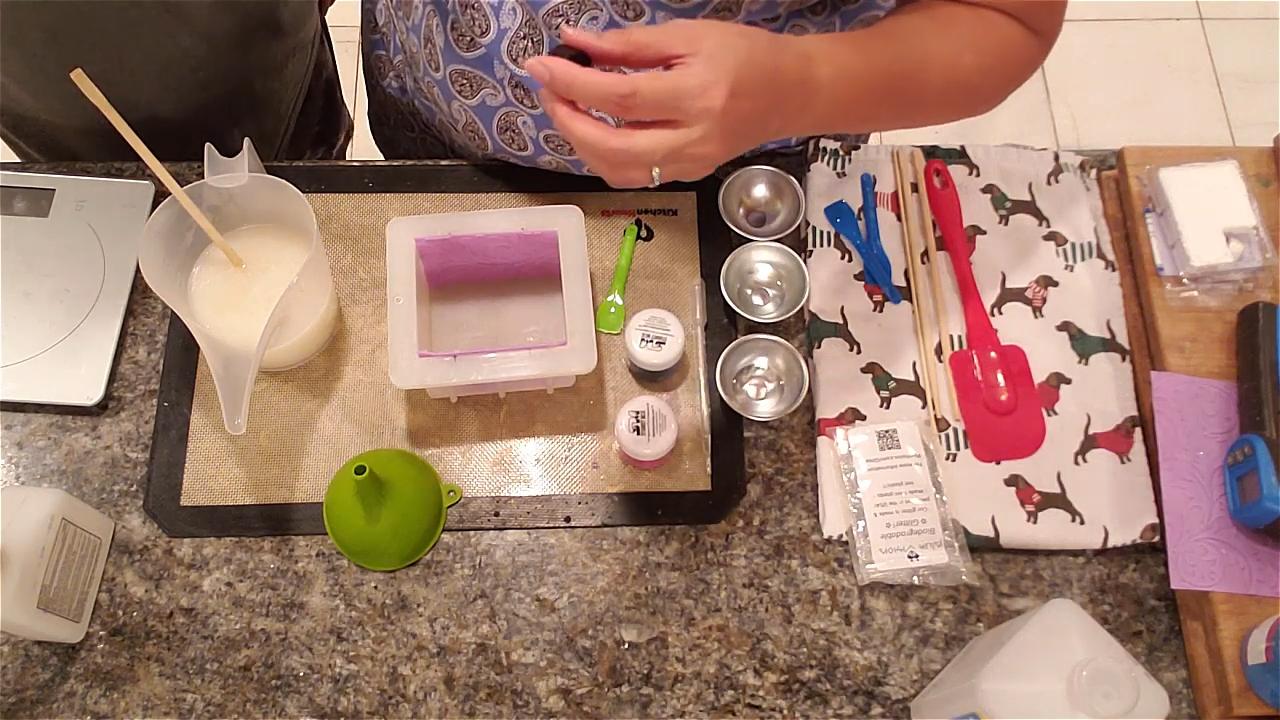 Pouring white shimmer soap into the mold