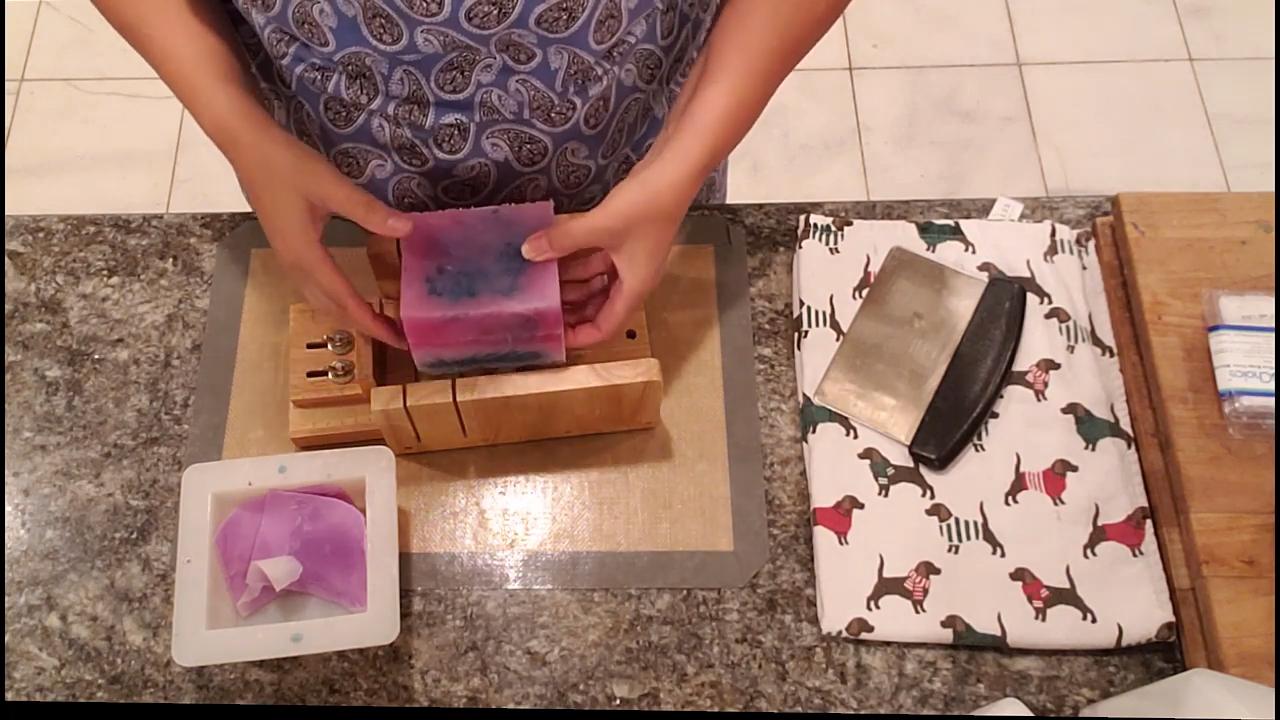 Unmolded funnel swirl soap loaf with a textured side