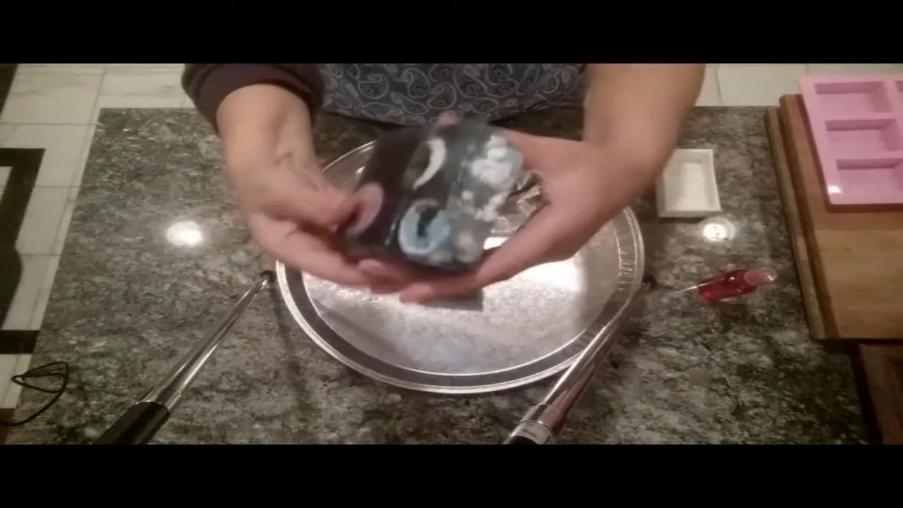Failed galaxy soap bar with gray galaxy and planet embeds