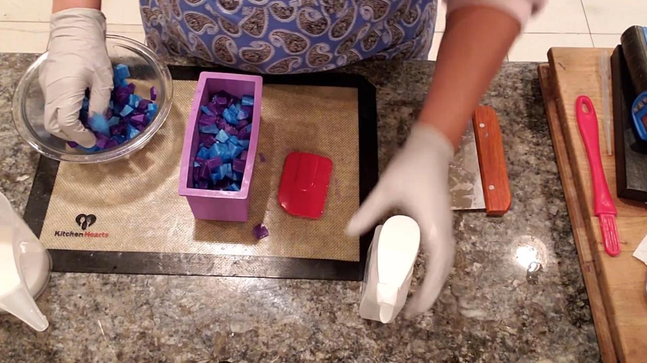 Adding chopped embeds to a small loaf mold