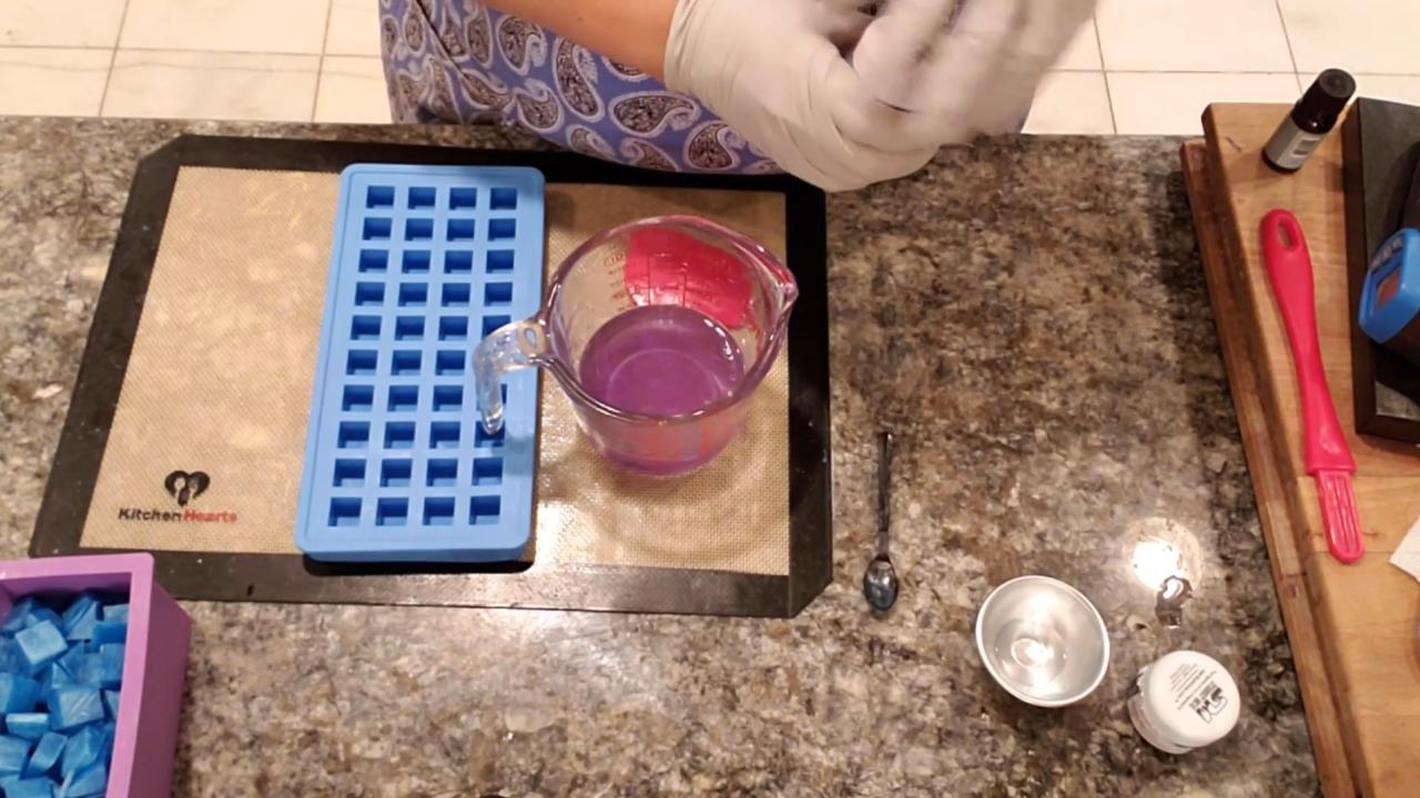 Mixing purple mica into clear melt and pour soap