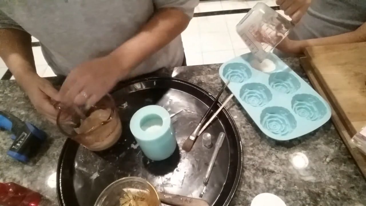 Pouring gold cupcake base soap into the giant cupcake mold