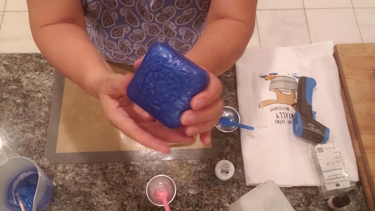 Finished blue Happiness soap with suspended glitter