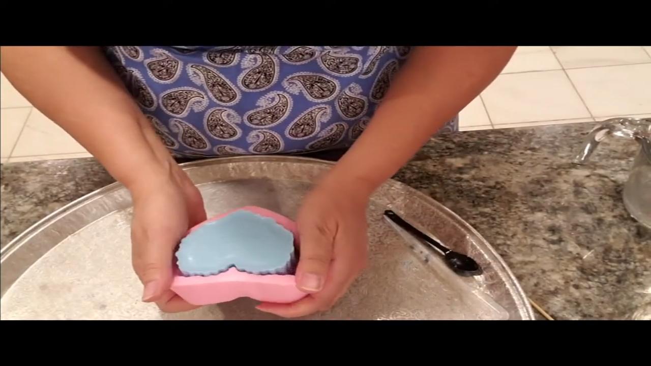 Peeling the mold off the heart soap