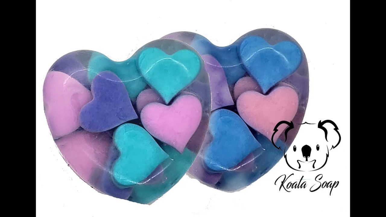 Finished heart embed melt and pour soap with pink, blue and purple hearts