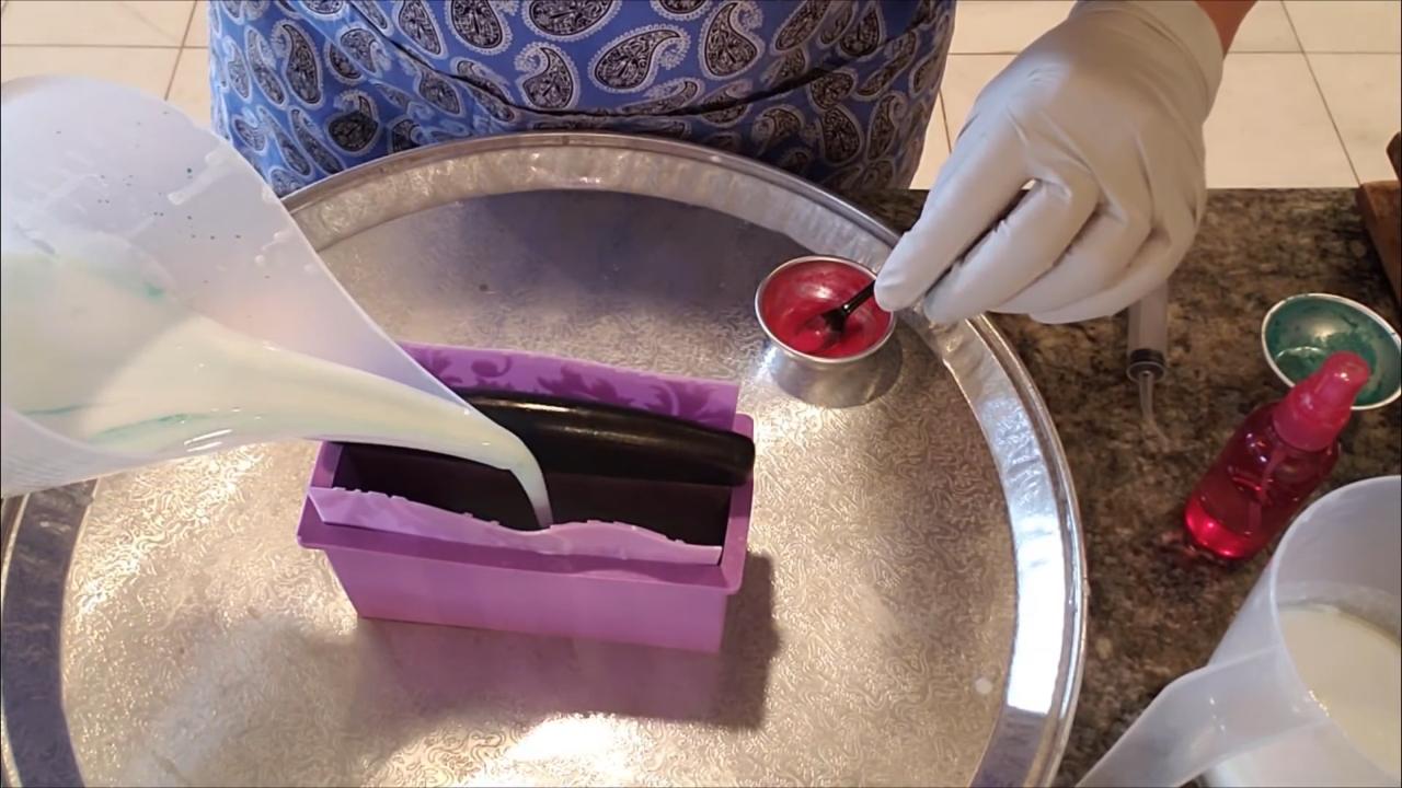 Pouring green soap beside the divider
