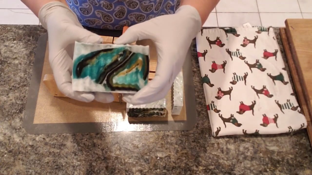 Cut Irish swirl melt and pour soap bar showing green, gold and black swirls