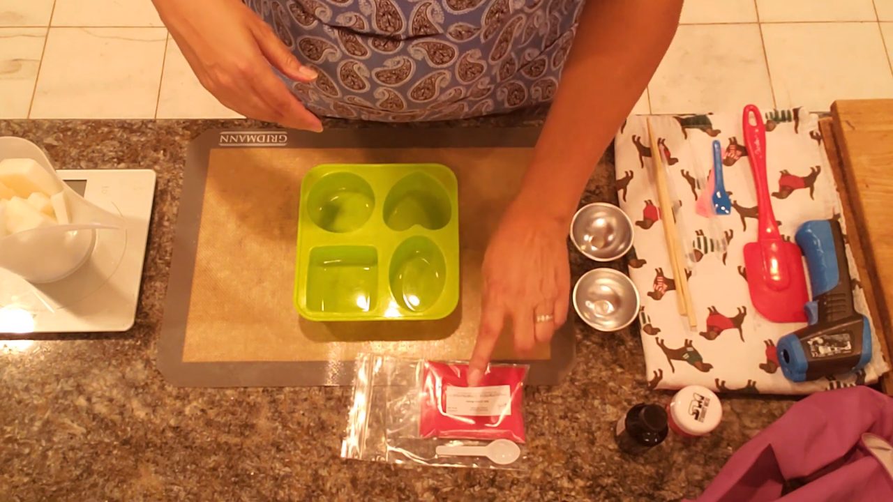 Shea butter melt and pour soap base, a silicone mold and a bag of red jojoba beads