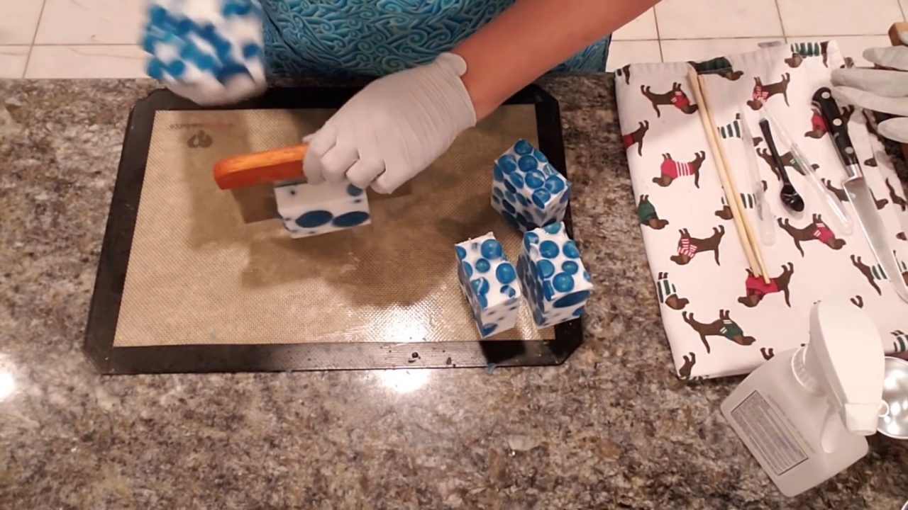Cut Jolly Dots melt and pour soap bars with blue ball embeds