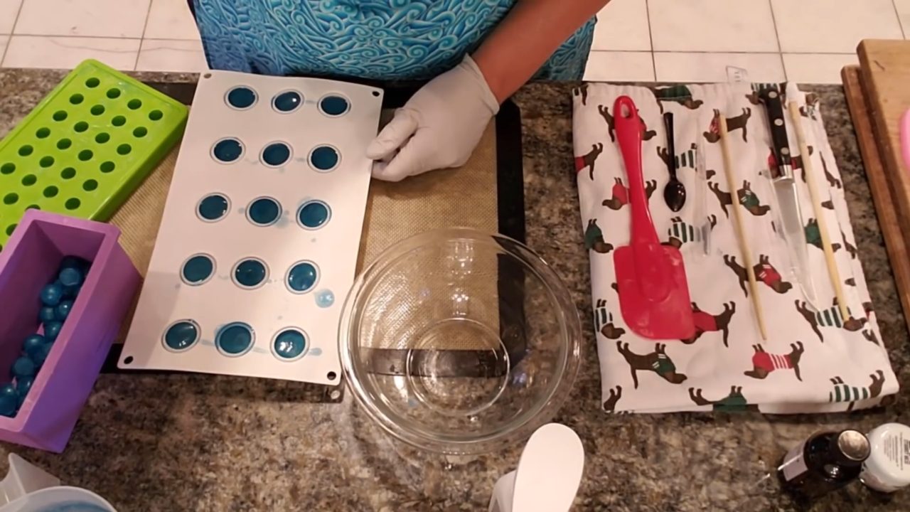 Unmolded blue soap ball embeds on a large ball mold