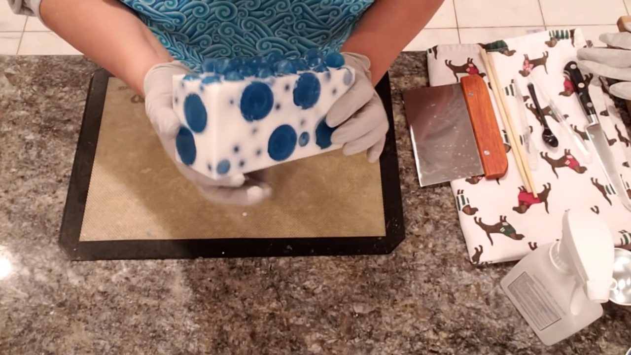 Unmolded Jolly Dots melt and pour soap loaf with blue polka dots