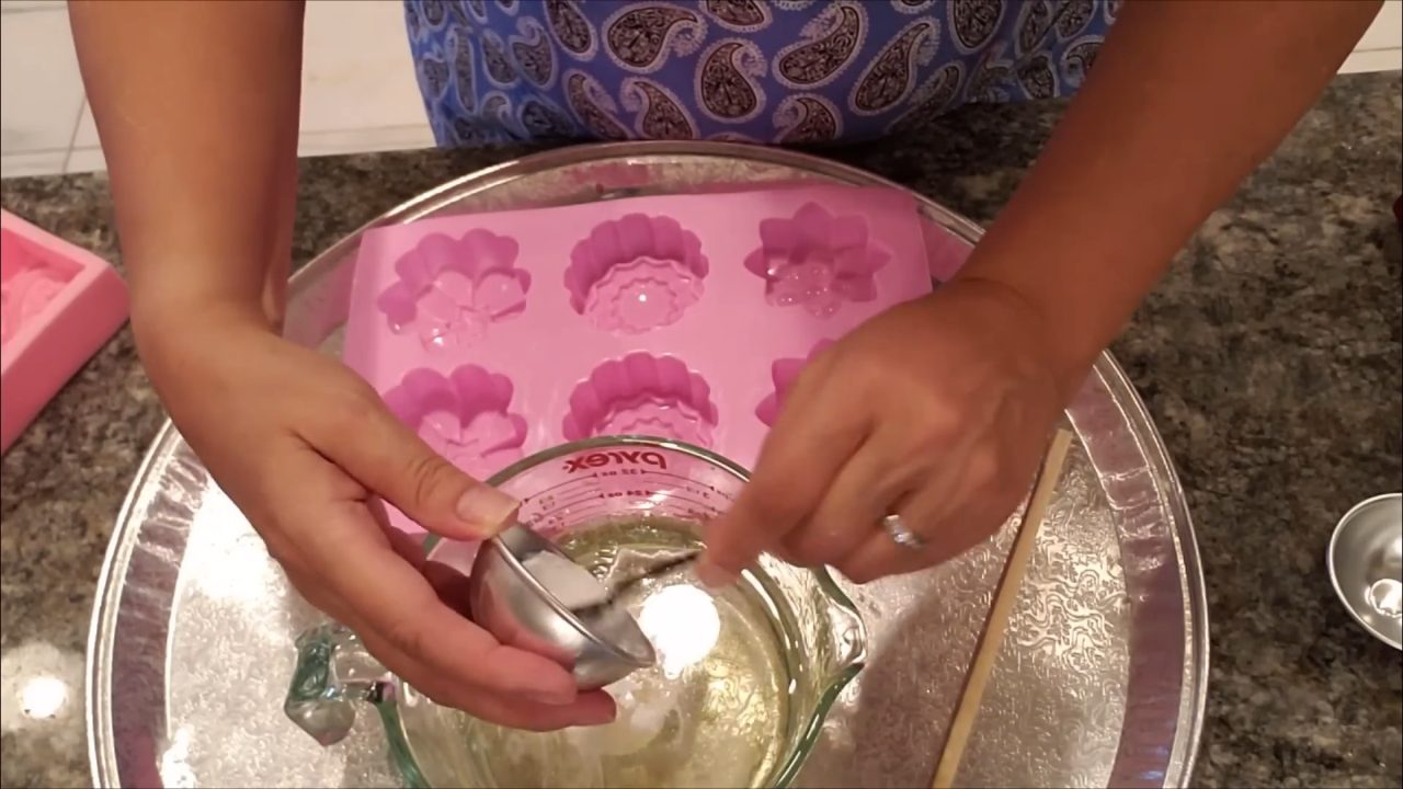 Mixing titanium dioxide into melted clear melt and pour soap with a milk frother