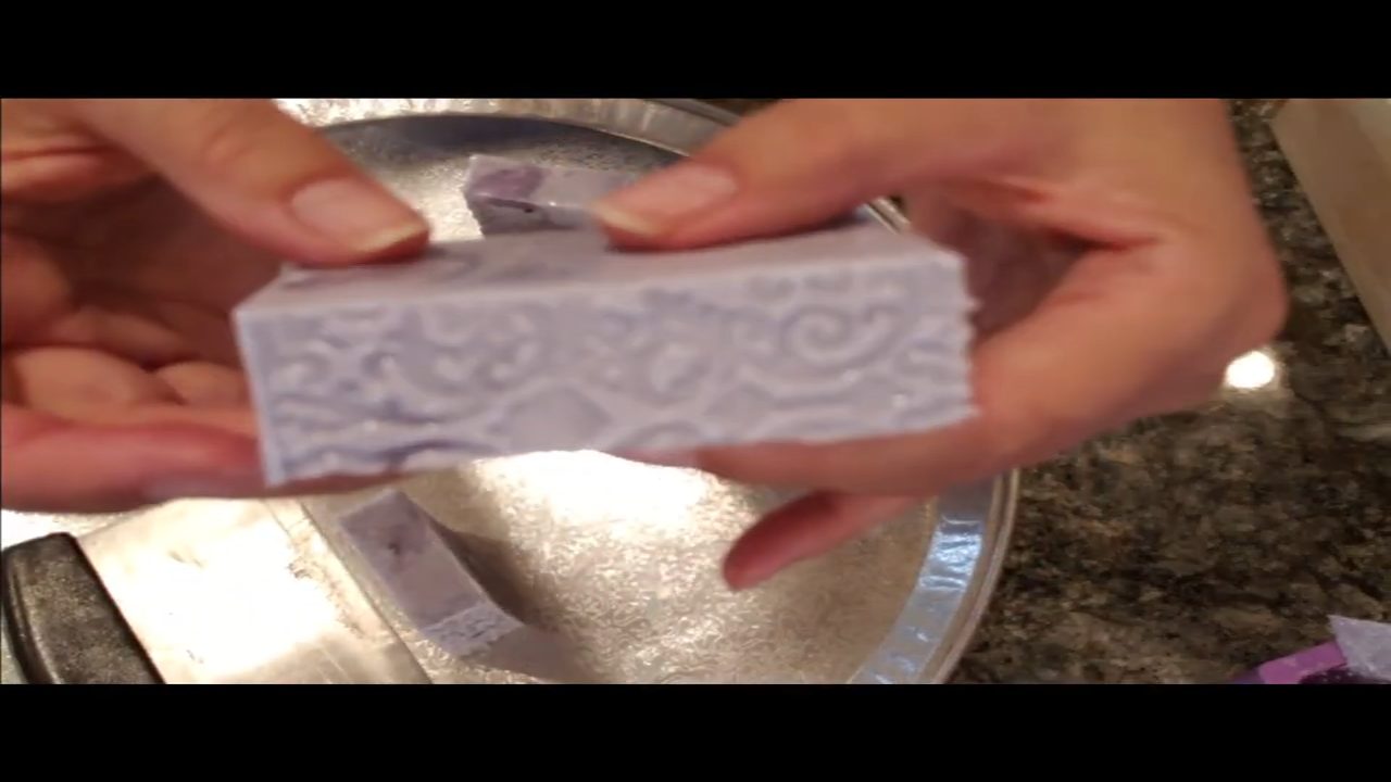 Finished Lavender Love soap bar with a raised fondant mat design on the side