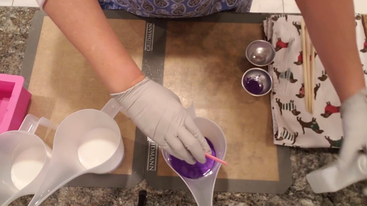 Mixing Violet Petal mica into melted clear melt and pour soap