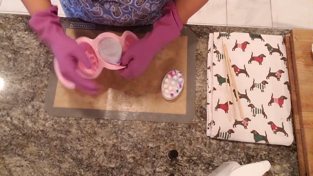 Unmolding a colorful shea butter massage bar soap