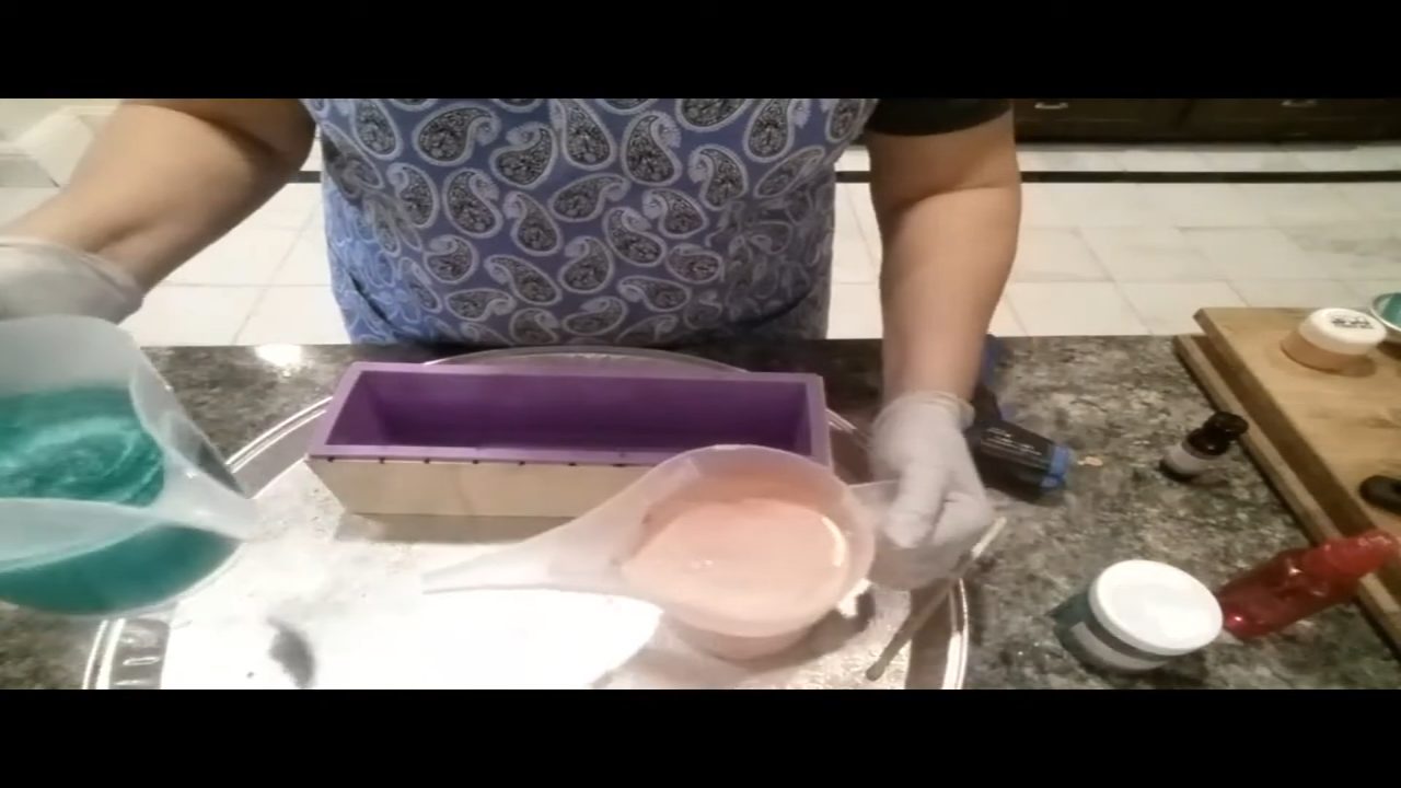 Orange goat milk soap and green clear soap ready to pour