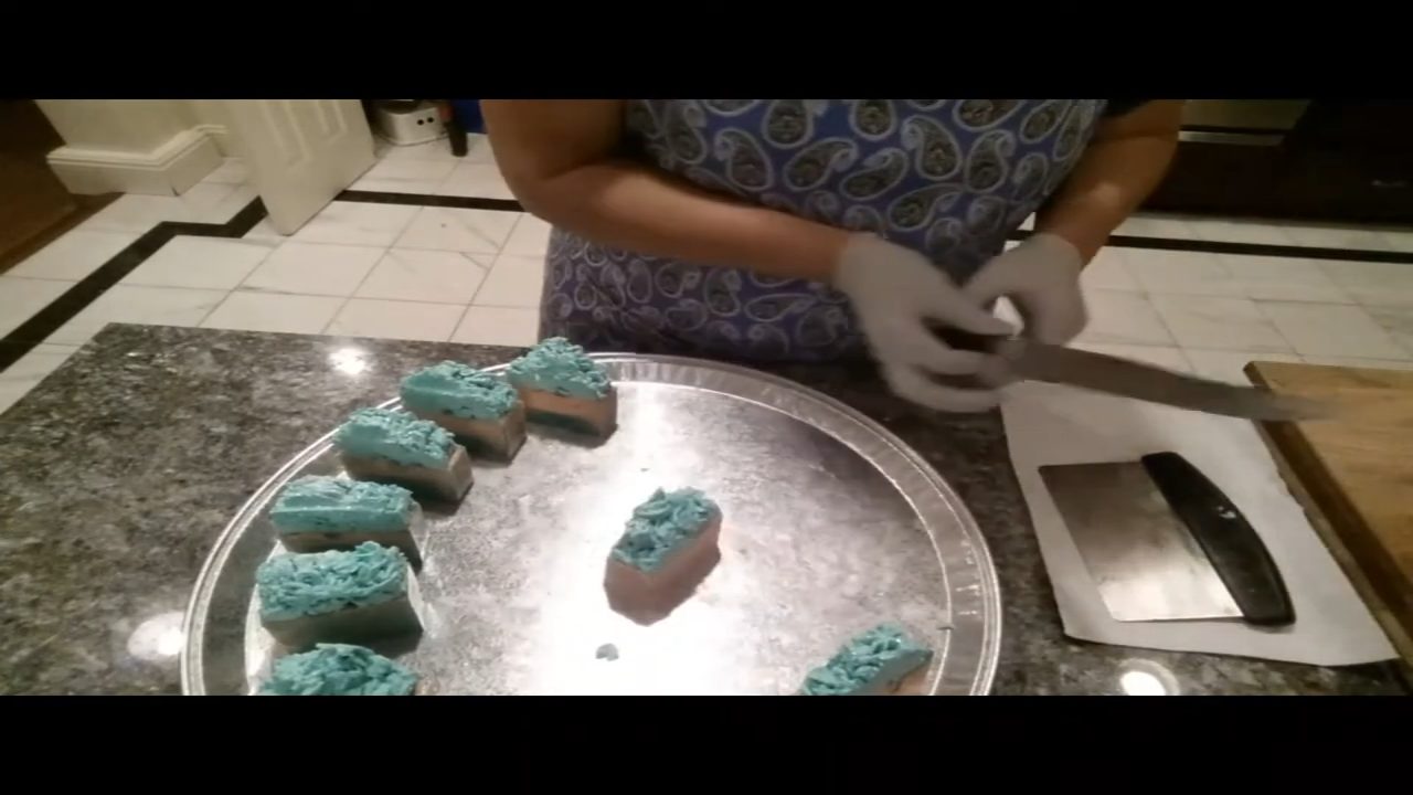 Cut bars of melt and pour soap with piped soap frosting
