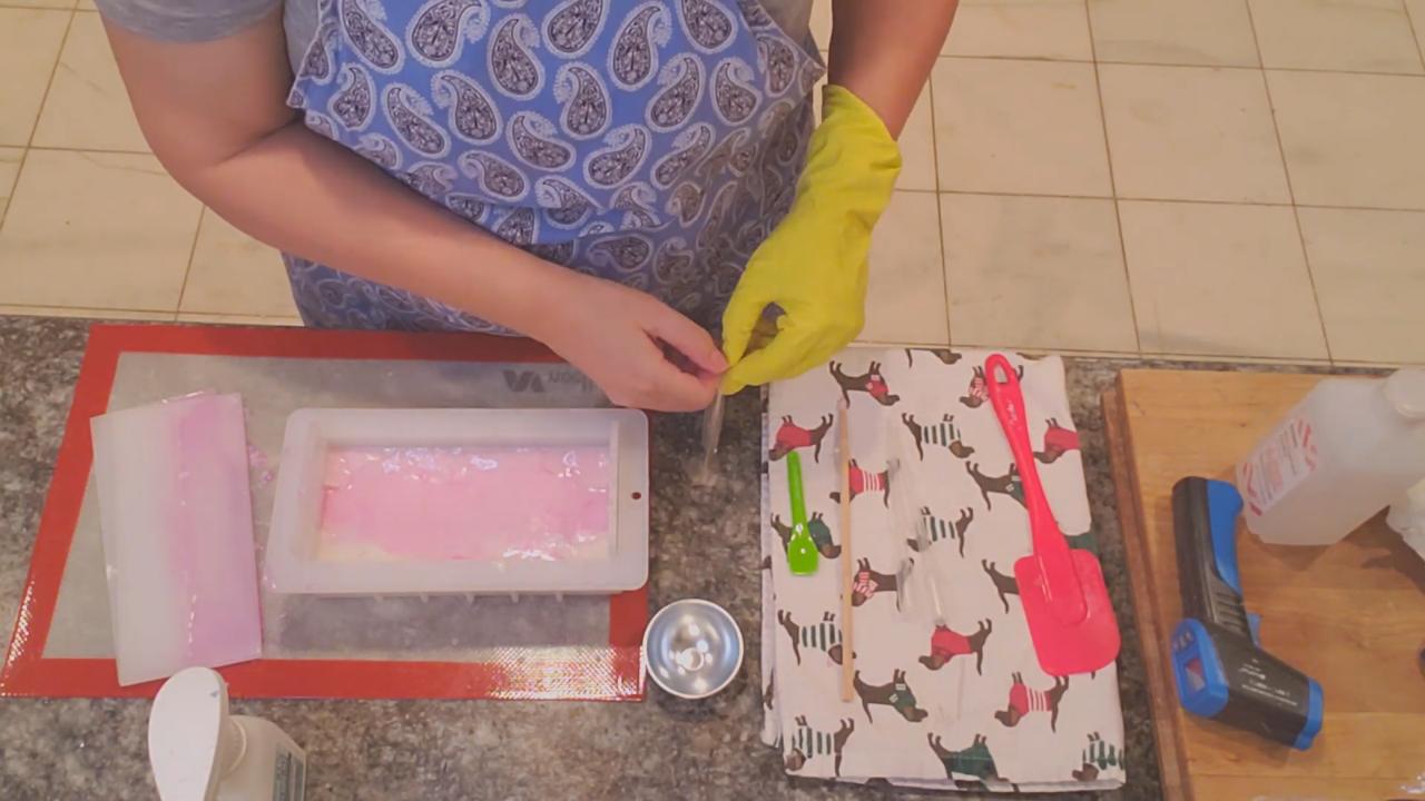 Adding bio glitter to the top of the pink soap