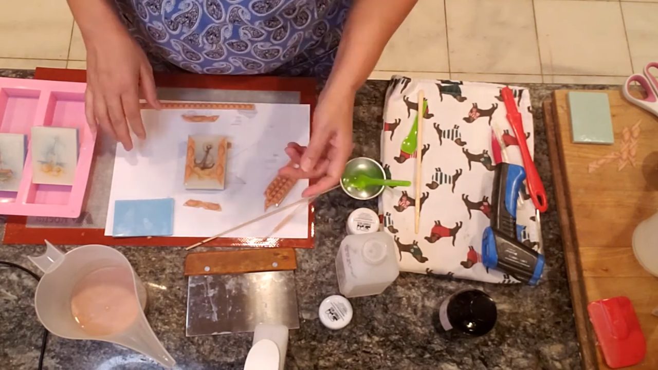 Gluing bronze soap rope frame pieces onto the picture soap