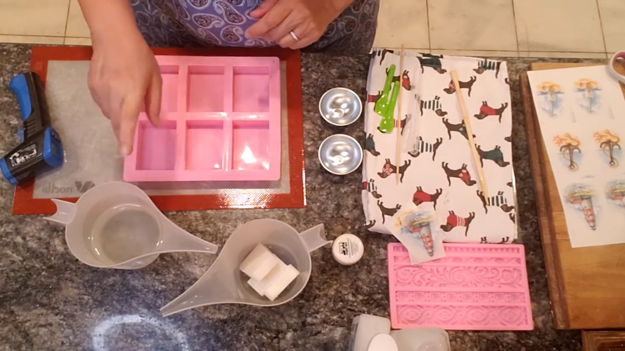 Pouring a thin layer of crystal clear melt and pour soap into a rectangle mold