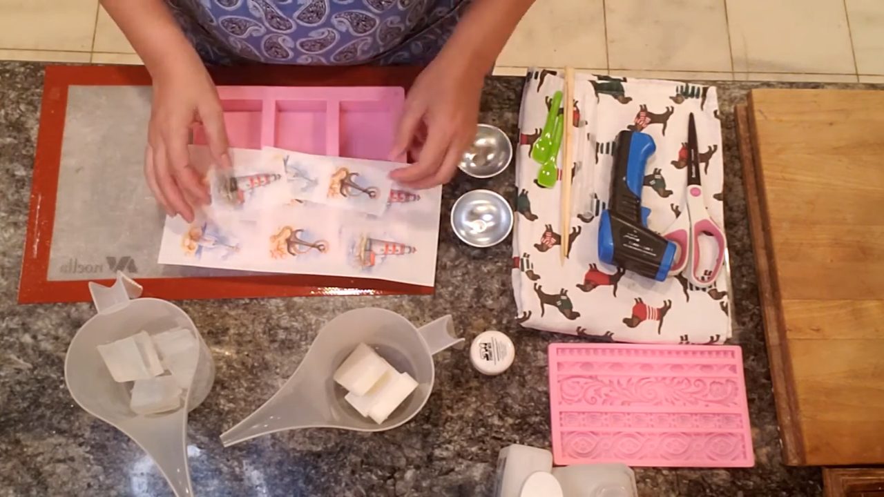 Nautical images printed on water soluble paper and cut to fit a pink soap mold