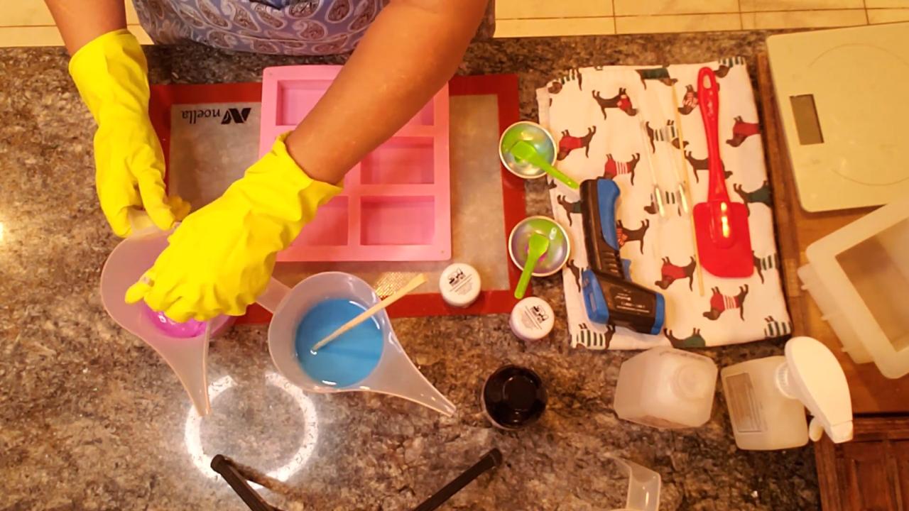 Pouring neon blue and purple soap into a cavity mold