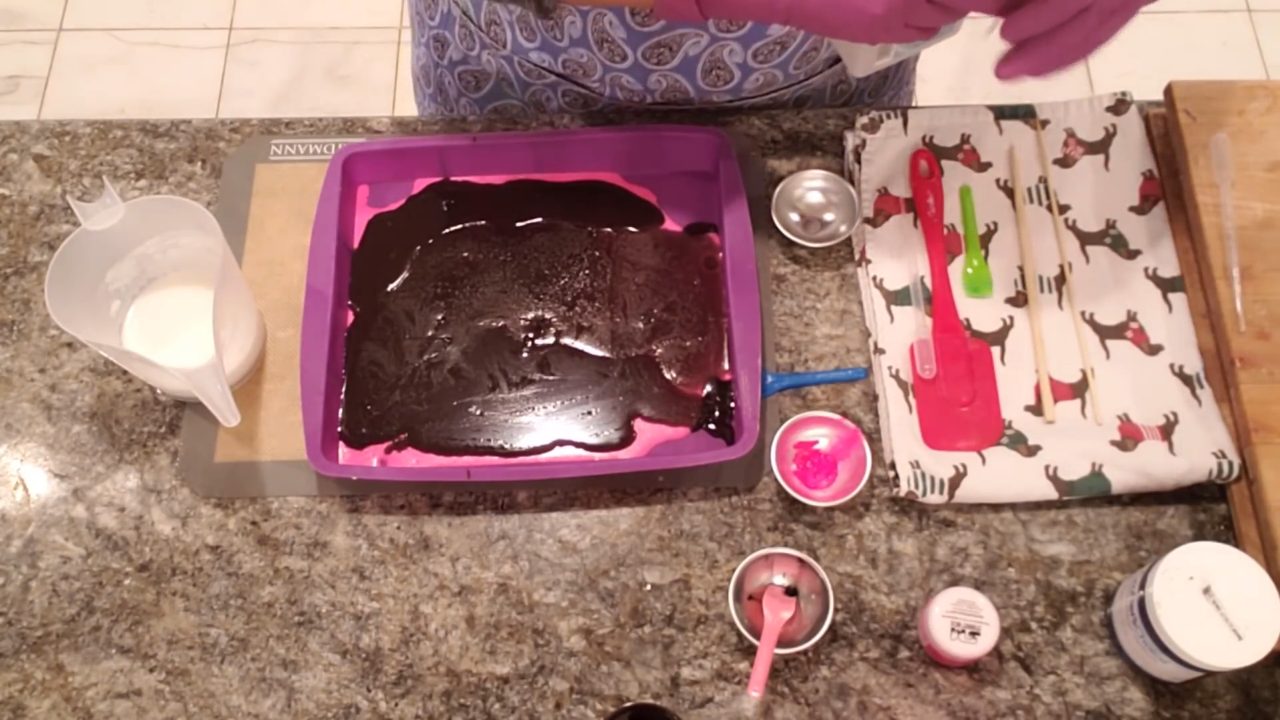 Black activated charcoal soap layer in the silicone pan