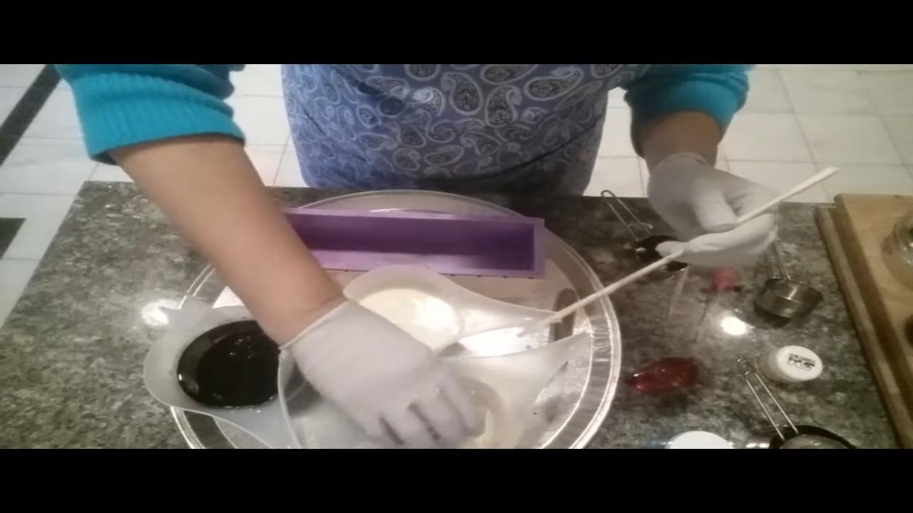 Mixing activated charcoal into melted soap