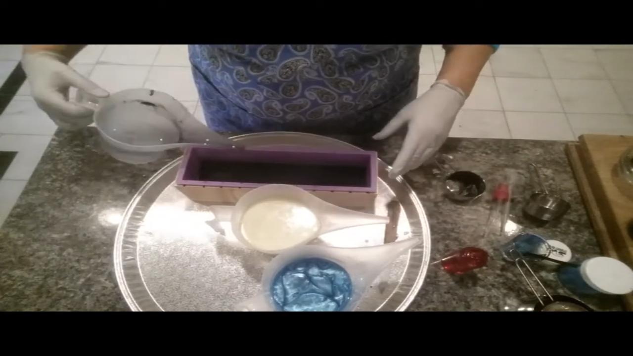 Mixing bright blue mica into melted soap