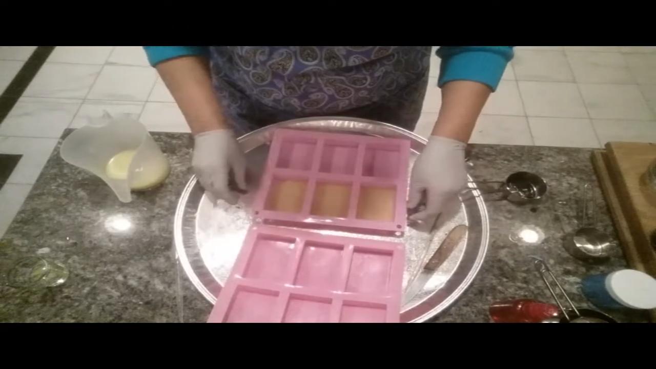 Thin yellow glitter soap poured in a silicone tray