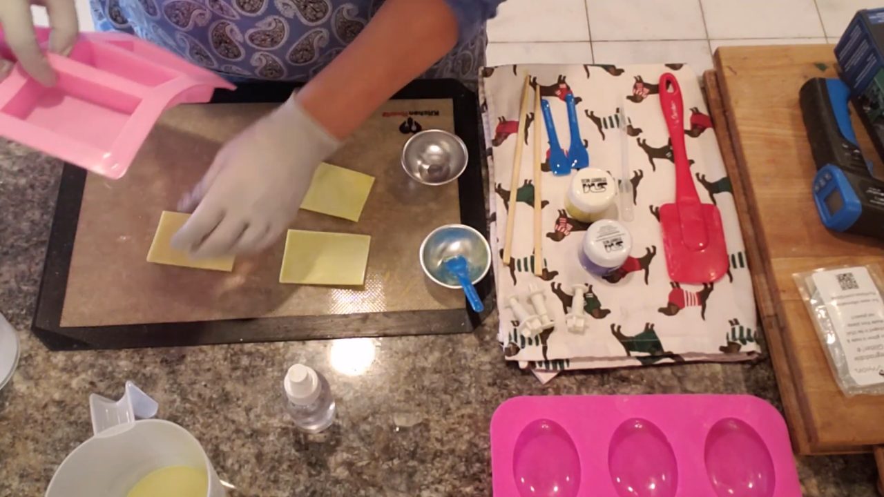 Cutting star shapes from a thin yellow soap sheet with fondant cutters