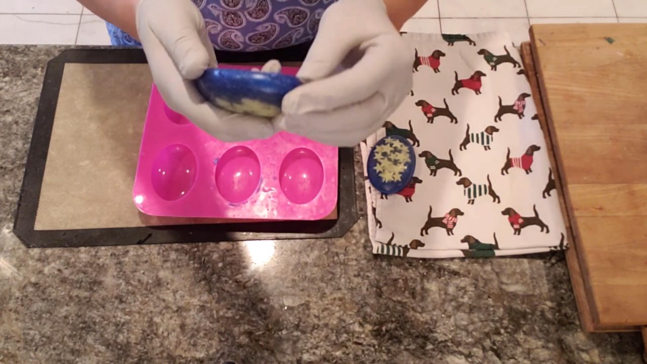 Unmolding night star melt and pour soap with yellow stars in clear soap