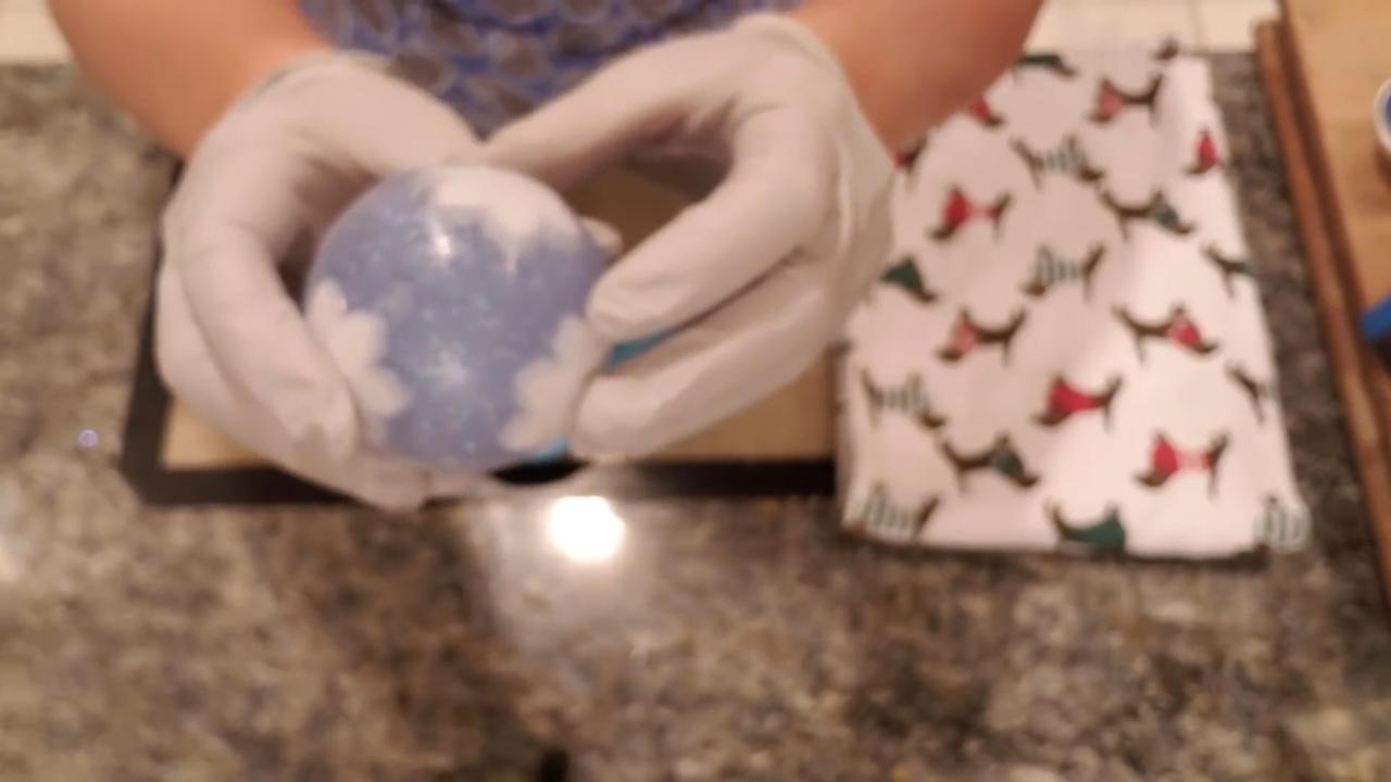 Light blue ornament ball soap with white snowflakes