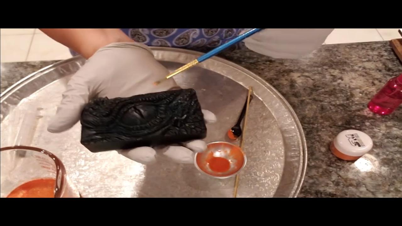 Brushing mica and alcohol onto the dragon eye soap