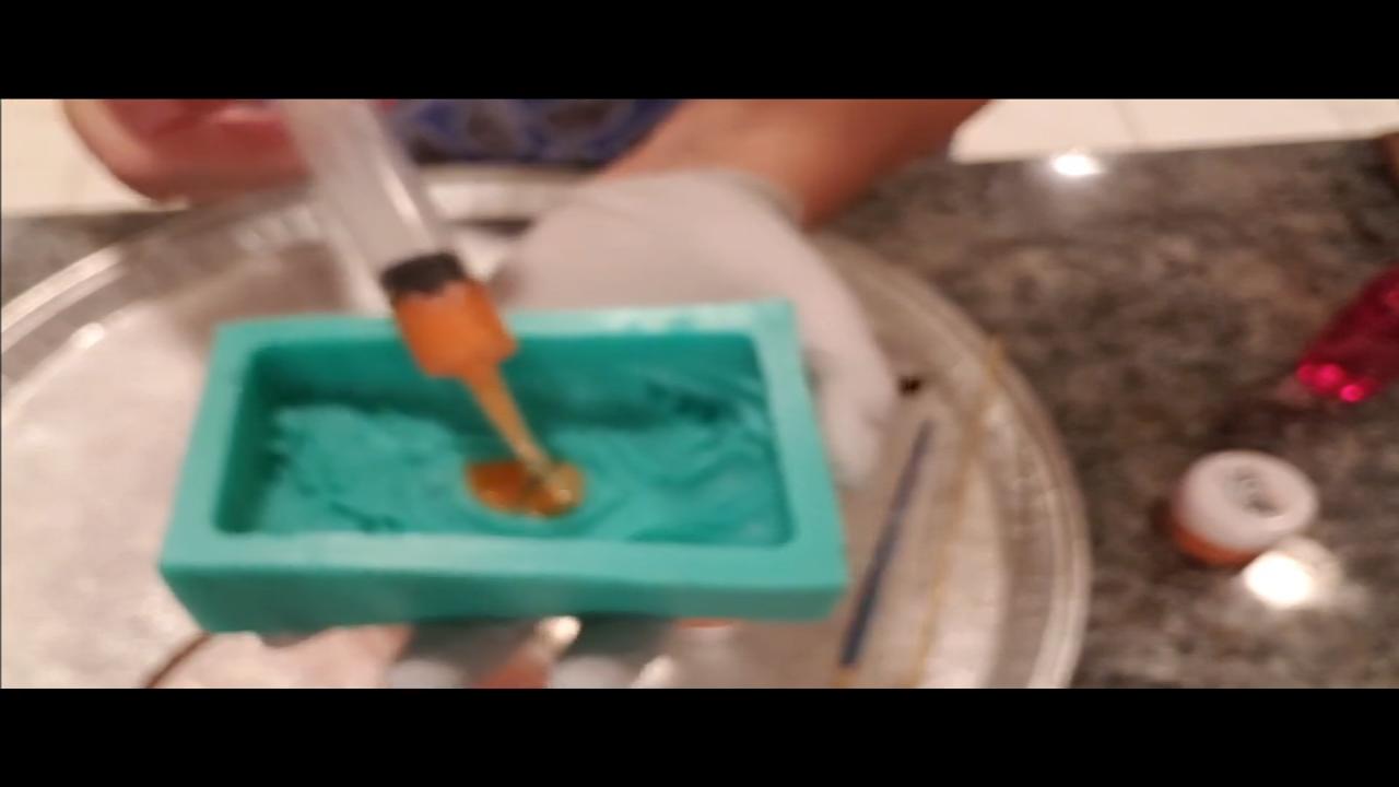 Colored soap dropped into the mold details