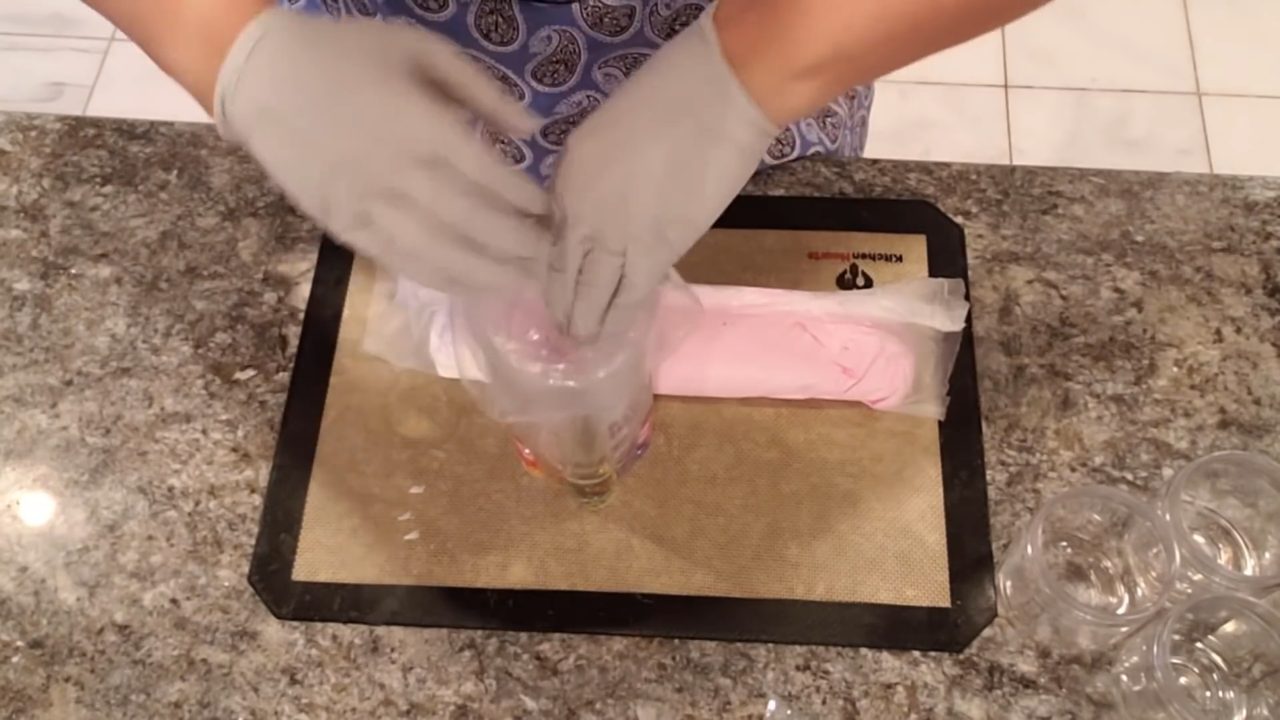 Putting the wrapped whipped soap log into a piping bag