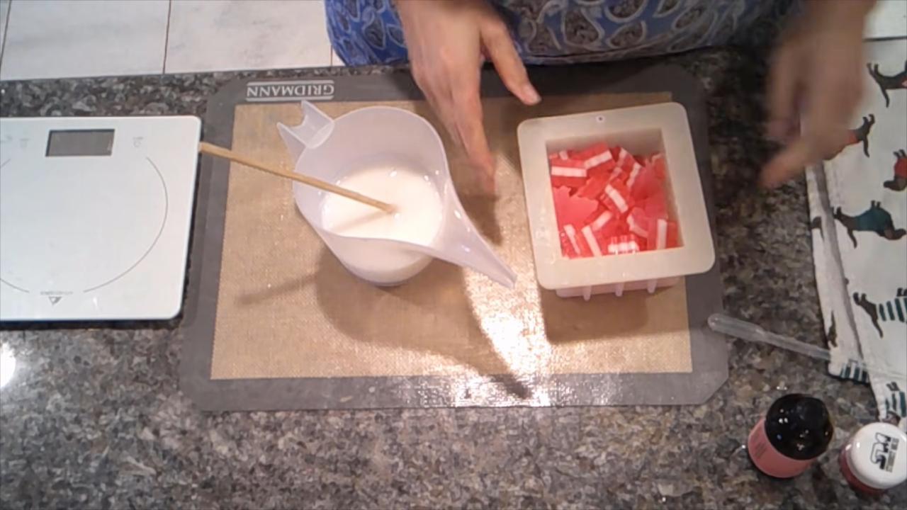 Red and white soap chunks in a square mold