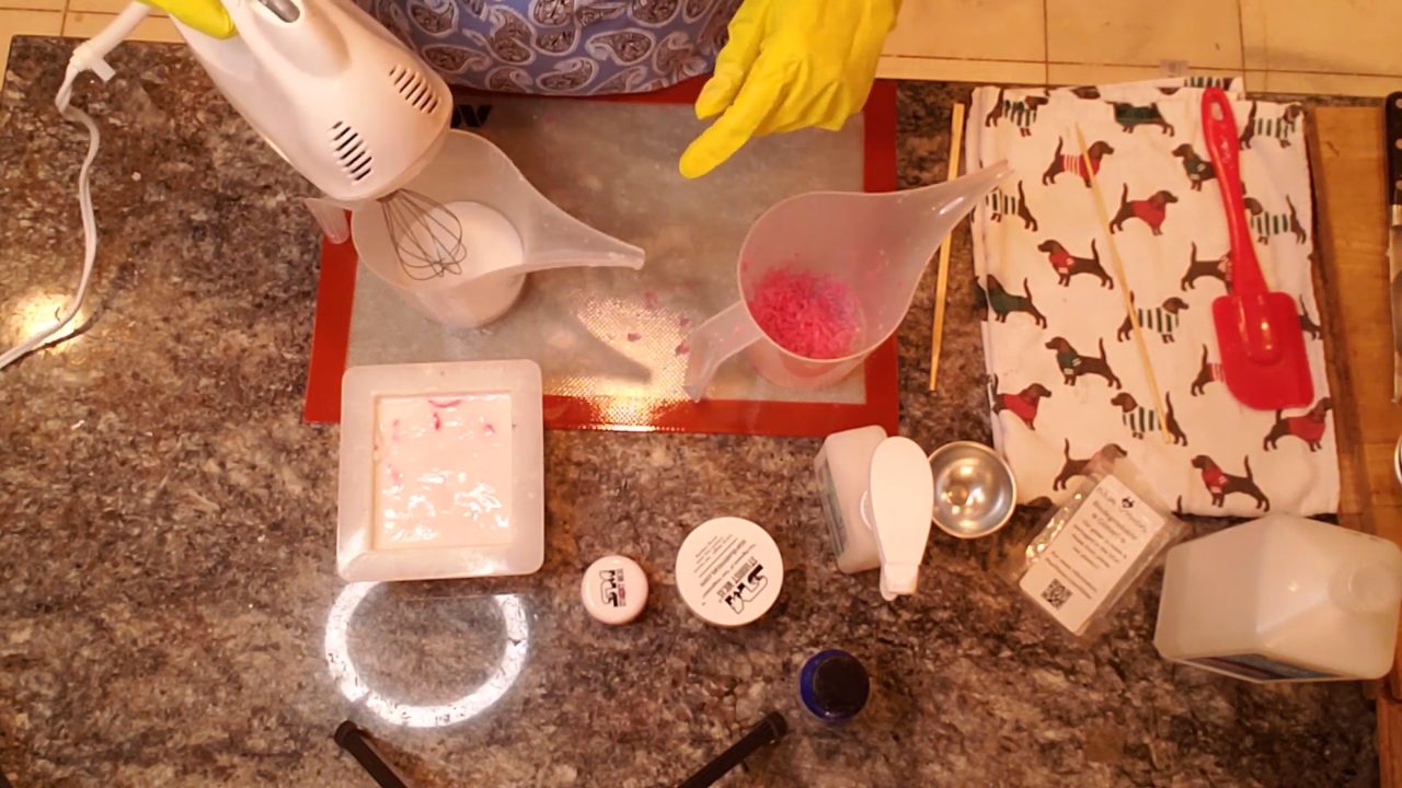 Whipping melted shea butter soap into soap frosting with a hand mixer