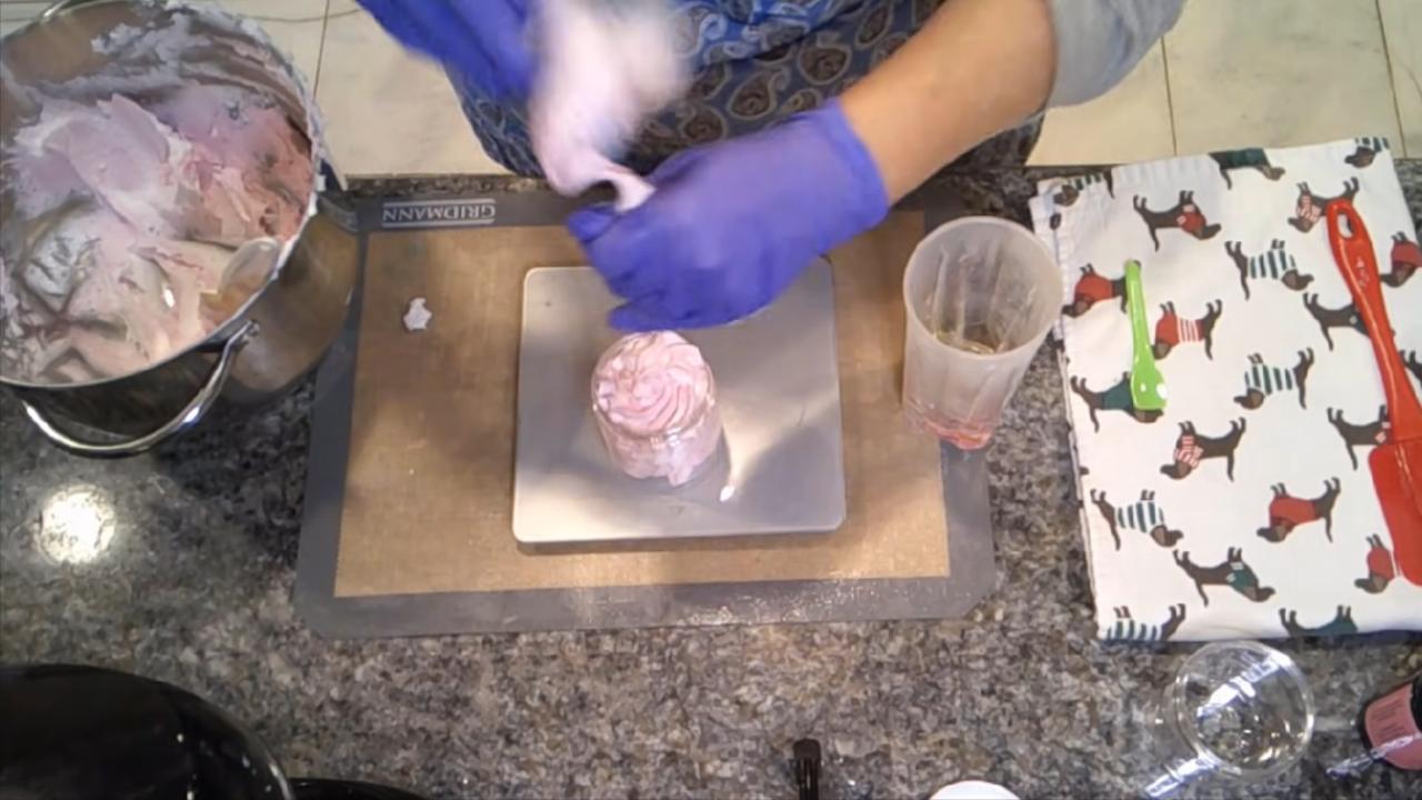 Piping swirls of sugar scrub on a scale