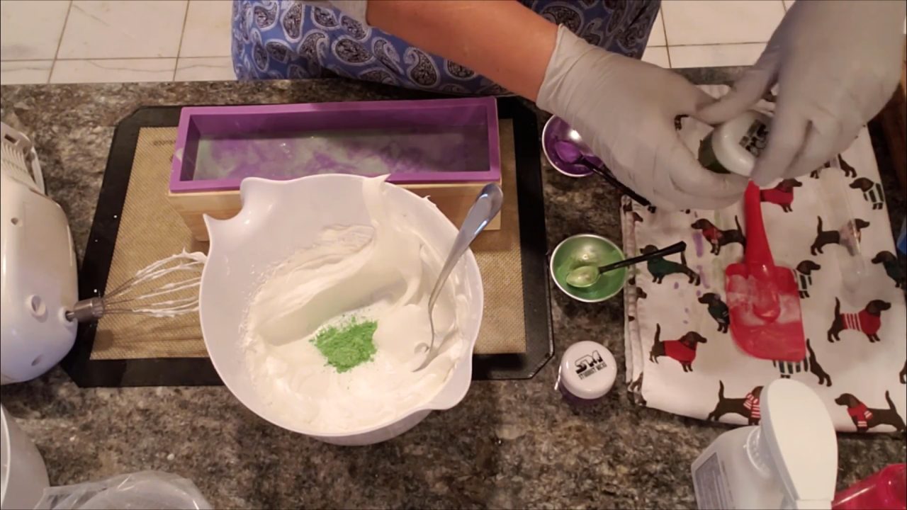 Folding green mica into Melt Whip and Pipe soap frosting