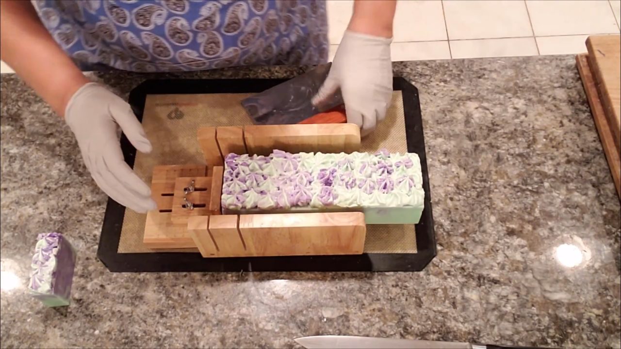 Unmolded piped floral melt and pour soap loaf ready to cut