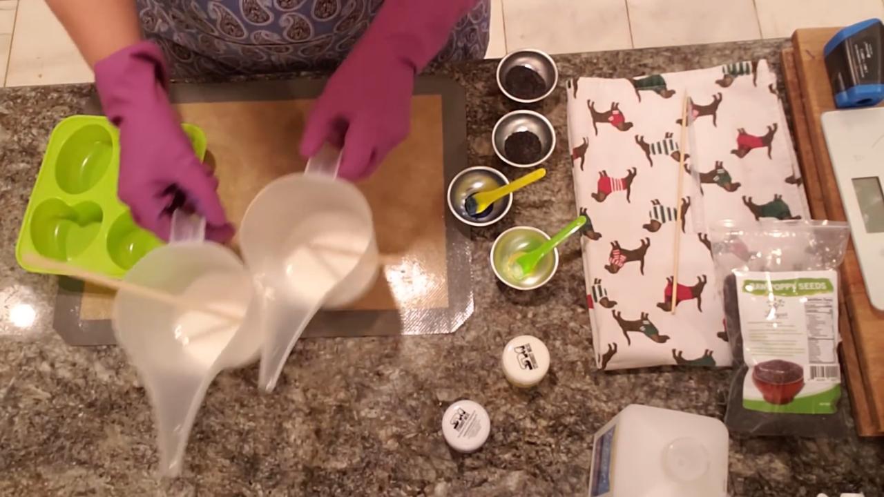 Stirring pale yellow color into melted soap