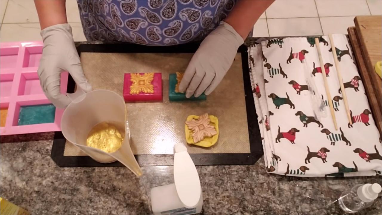 Finished red and teal holiday soaps with gold embeds