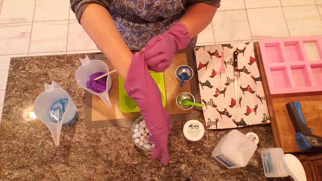 Pouring the first layer of colored clear soap into the mold