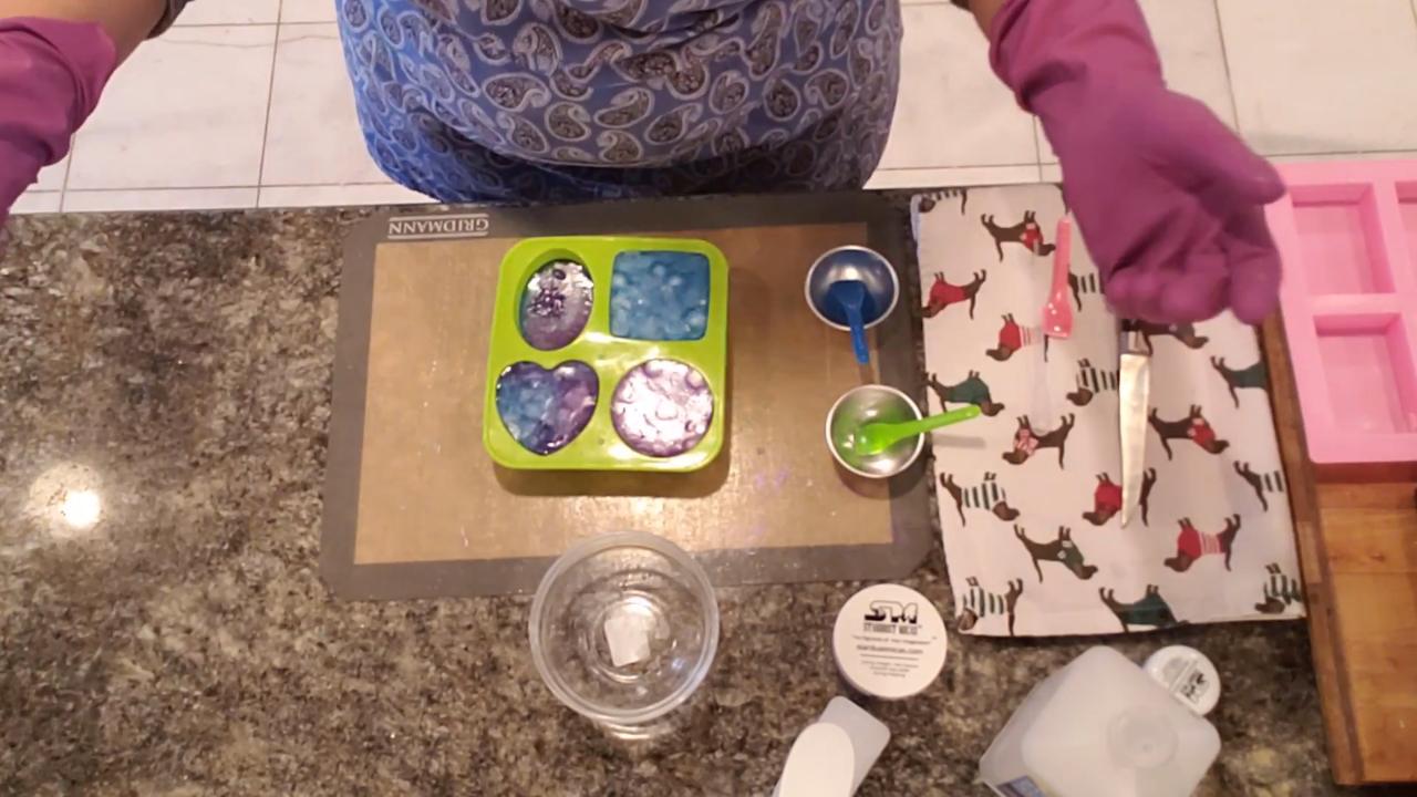 Violet and blue clear soap layered with white embeds in a multi-shape mold