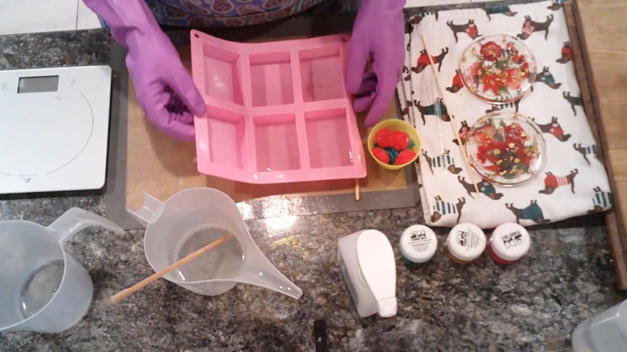 Placing rose and gold embeds into clear soap