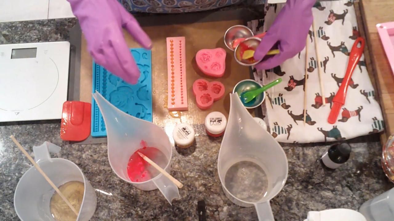 Pouring red soap into the rose embed mold
