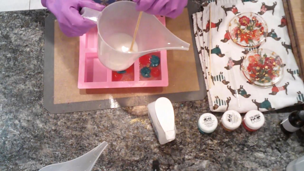 Pouring white shea butter soap for the back layer